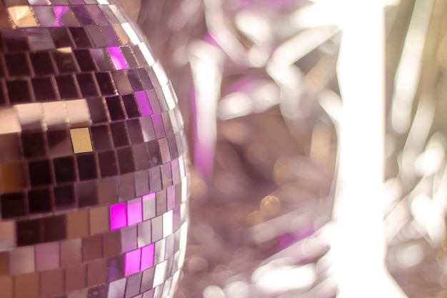 Shiny disco ball in pink tones closeup