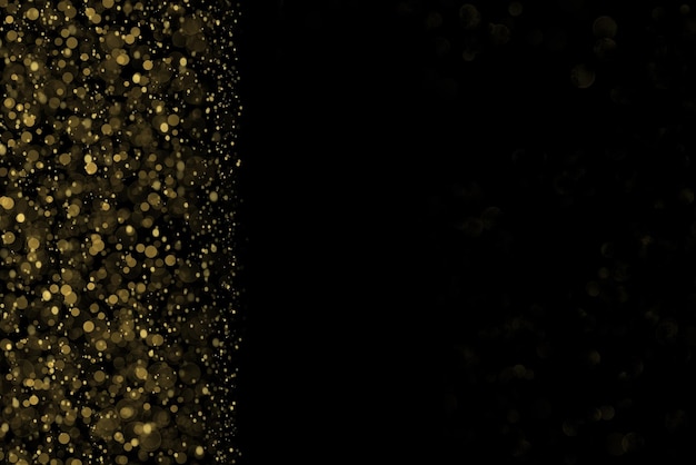 Photo shiny glitter abstract vertical left bokeh background on black