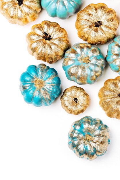Shiny gold and blue Pumpkins. Halloween decorations.  trendy holiday concept.