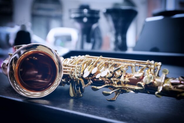 Shiny golden alto saxophone with detailed view of keys