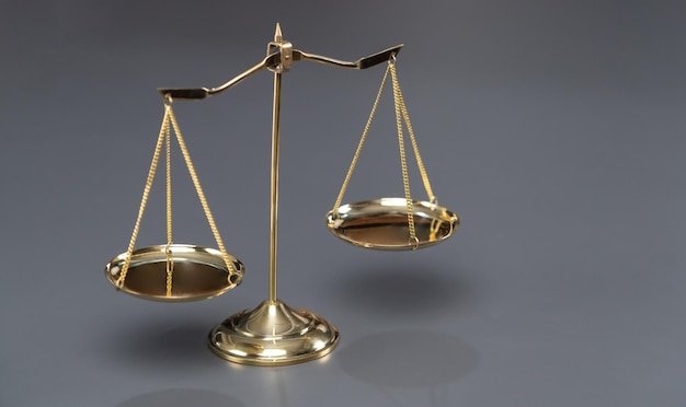 Shiny golden scale balance in background as justice symbol Equilibrium