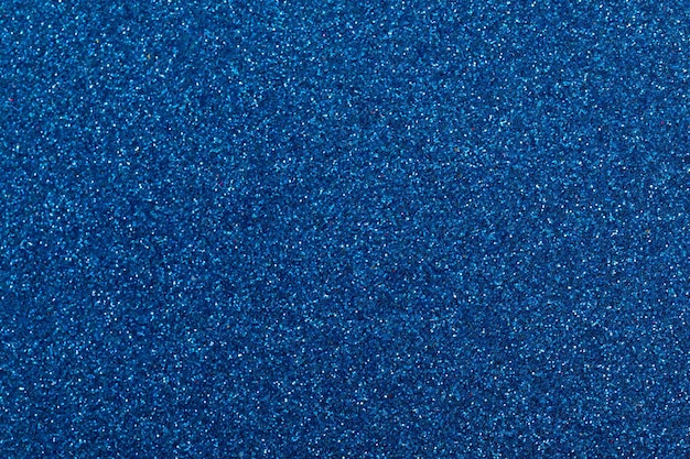 Foto carta luccicante di luccichii metallici con sfondo blu iridescente