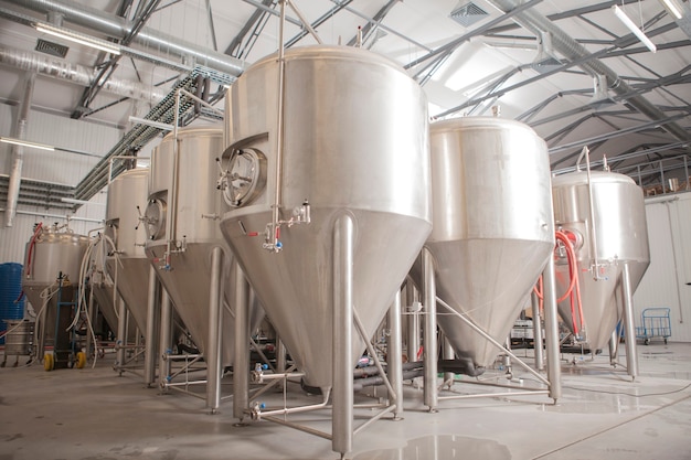 Shiny microbrewery beer tanks at beer factory