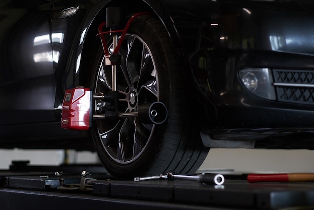 shiny new car at auto service got a problem with tyres, which will be sorted soon.