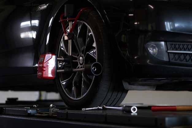 Shiny new car at auto service got a problem with tyres, which will be sorted soon.