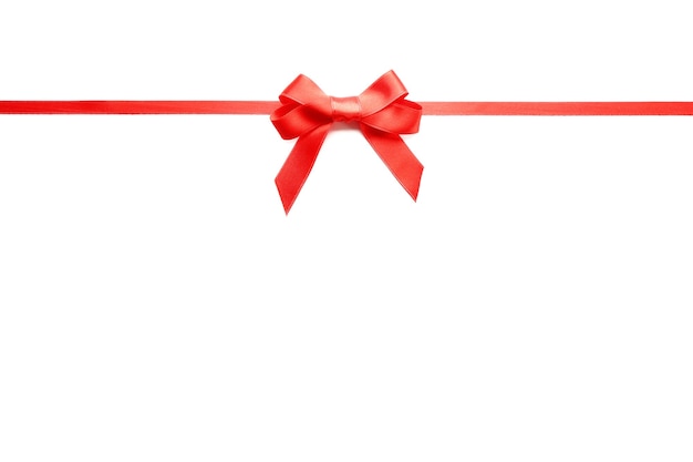 Shiny red ribbon with bow isolated on white