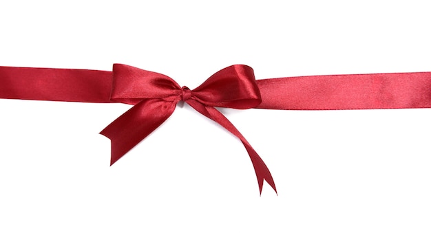 Shiny red ribbon with bow isolated on white