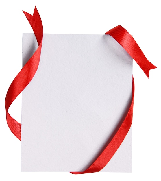 Shiny red ribbon with card isolated on white