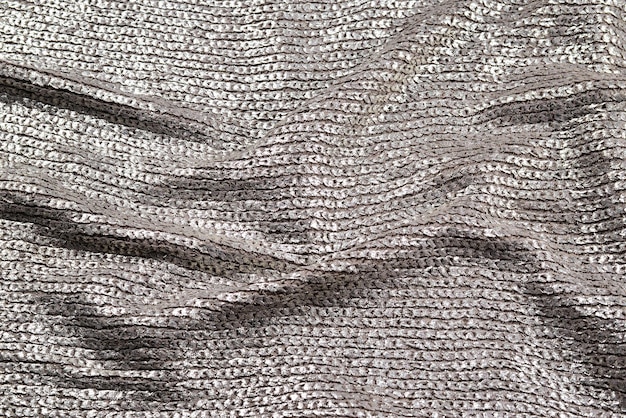 Shiny silver fabric texture.