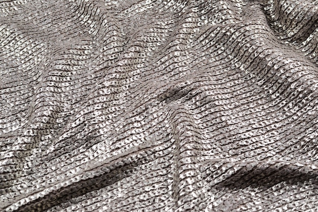 Shiny silver fabric texture.