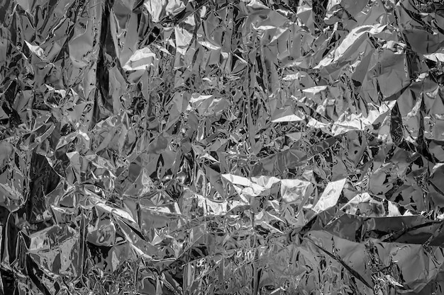 Shiny silver foil texture for background Black and white photo