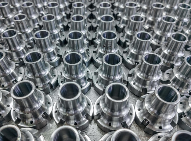 Shiny steel parts full frame industrial cnc turning production background