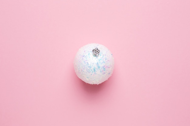 Shiny white balls on a pink background