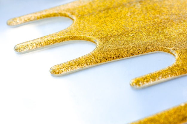 Photo shiny yellow background. abstract elegant, gold glitter particles flow.