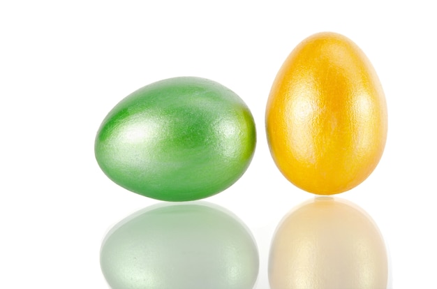  shiny yellow and green Easter egg on white