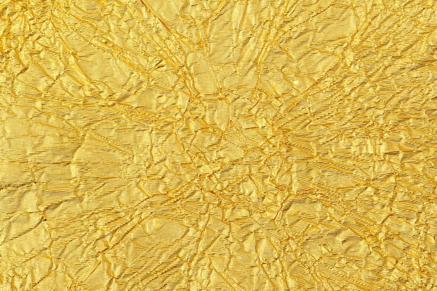 Shiny yellow leaf gold foil texture background