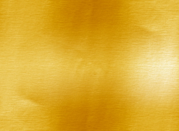 Shiny yellow leaf gold foil texture background