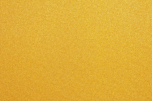 Photo shiny yellow surface gold glitter texture abstract background