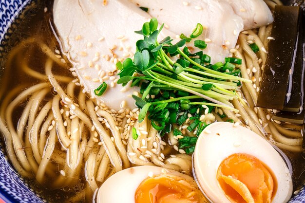 Shio ramen noodle soup with chicken and eggs