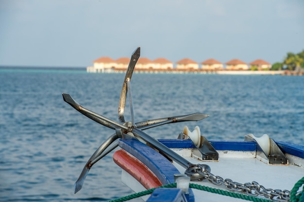 Ship anchor on ocean background