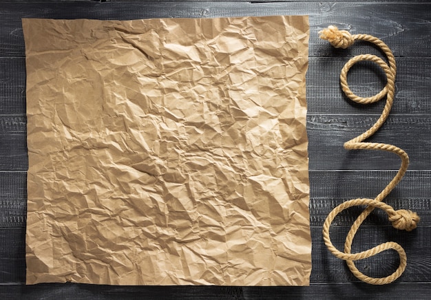 Ship rope at wooden background texture