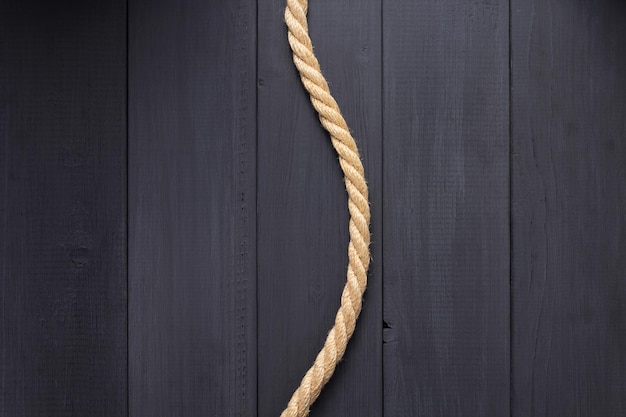 Ship rope at wooden table, plank board background texture