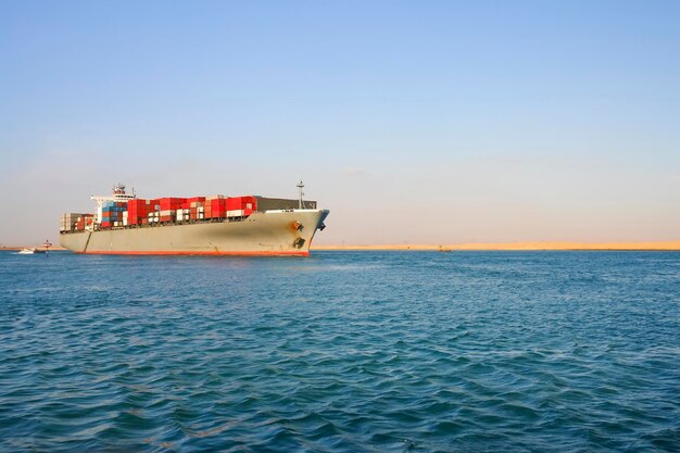 Ship sailing on sea against sky