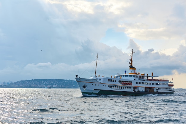 The ship sails at sunset on the Bosphorus Strait in Istanbul. Istanbul, Turkey - 28