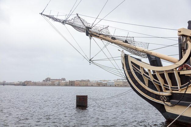 A ship in the water with the city in the background