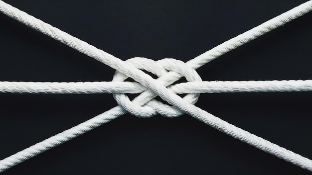 Ship white ropes knot isolated on black background