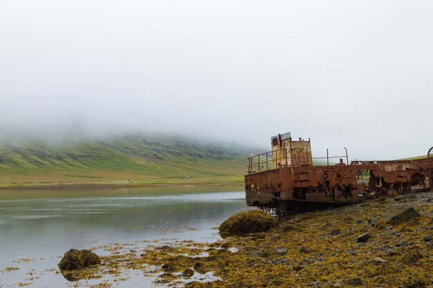 Shipwreck from Mjoifjordur fiord, east Iceland. Icelandic panorama