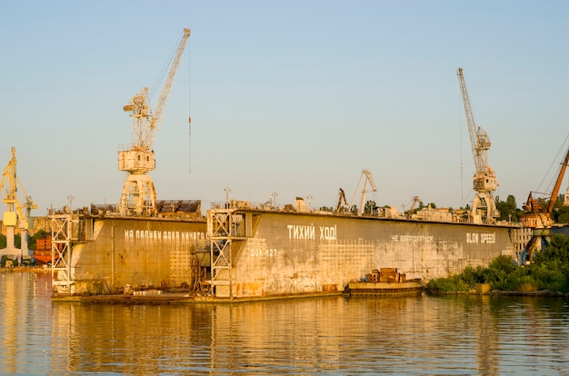 shipyard with floating dock and ship