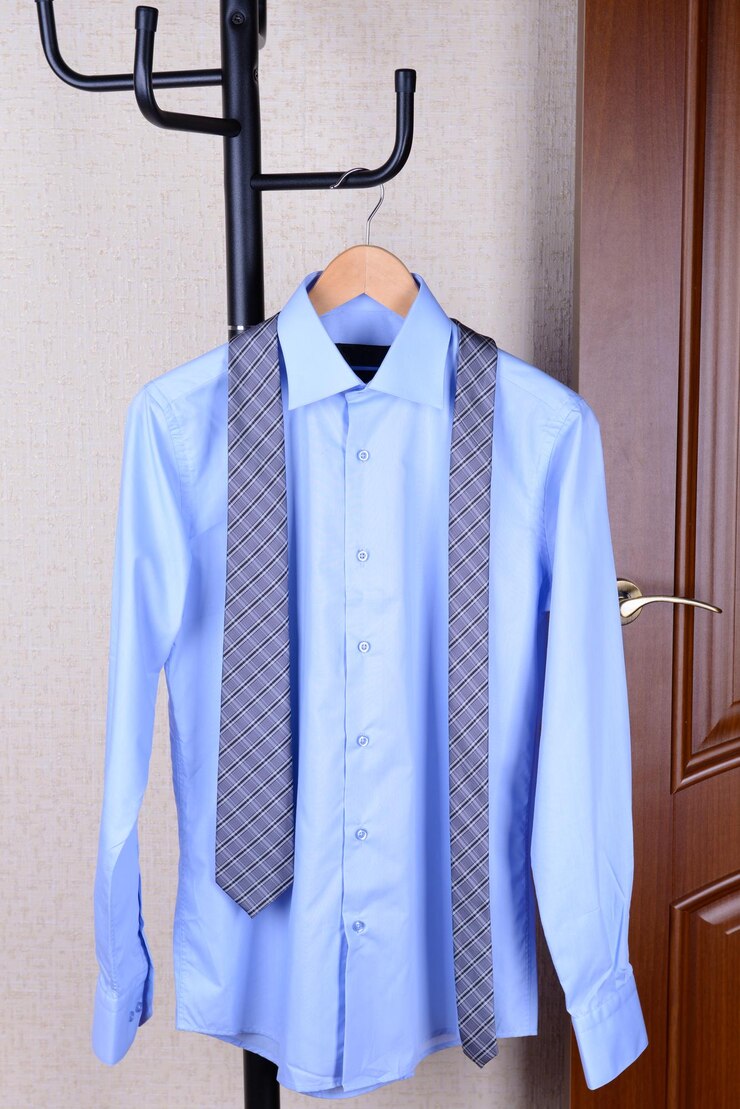 Photo shirt hanging on hanger near door