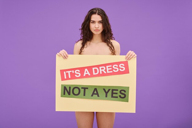 Shirtess feminist woman with poster