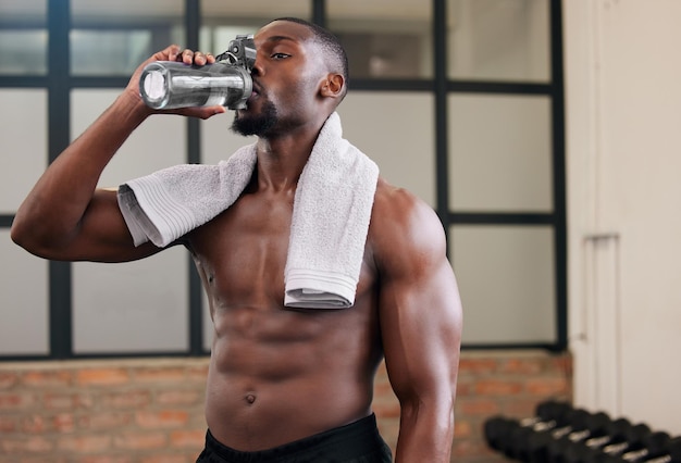 Premium Photo  Shirtless black man gym and water bottle for