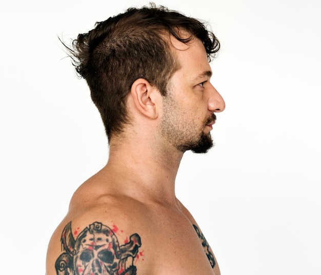 Shirtless guy with tattoo on white background