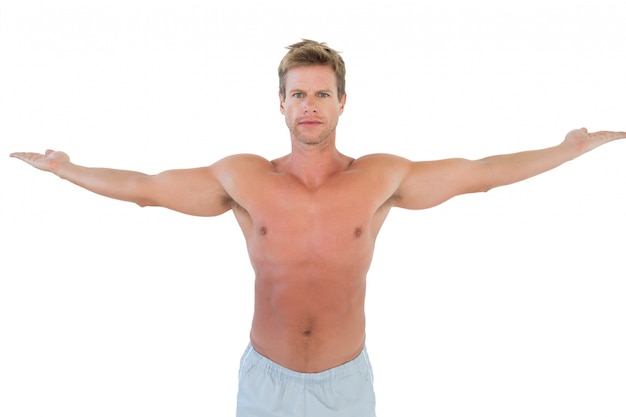 Shirtless man opening his arms