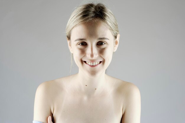 Shirtless portrait of a young beautiful blonde girl
