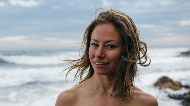 Shirtless woman at beach