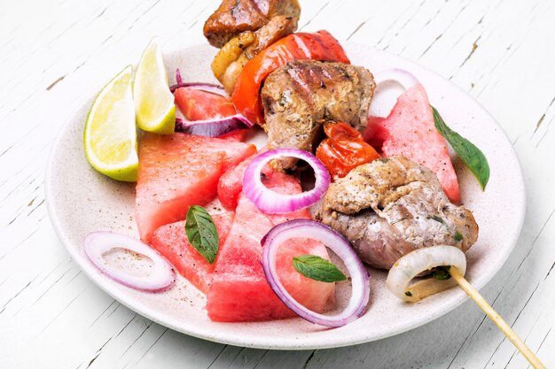 Shish kebab with watermelon garnish