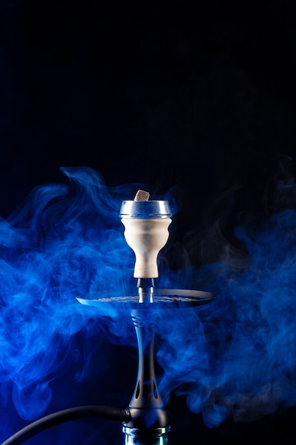 Shisha hookah with hot coals on black background