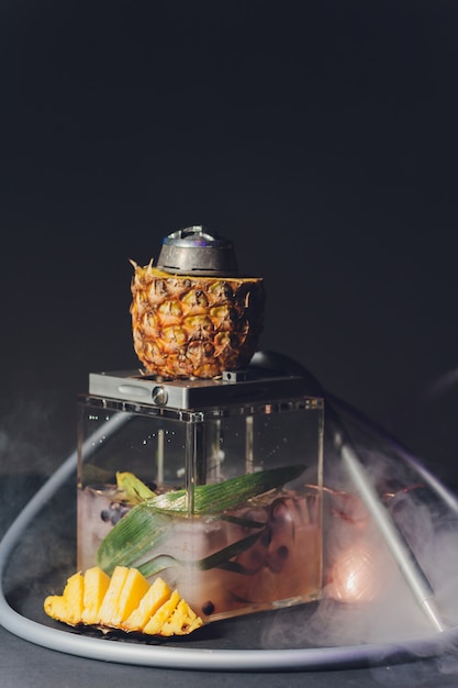 Shisha With Fruit Bowl With Colorful Smoke In Hookah Bar Closeup.