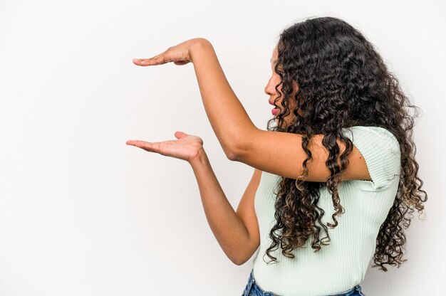 Shocked and amazed holding a copy space between hands