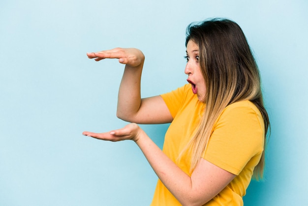 Shocked and amazed holding a copy space between hands