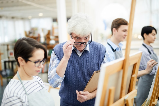 Shocked Art Teacher Looking at Painting