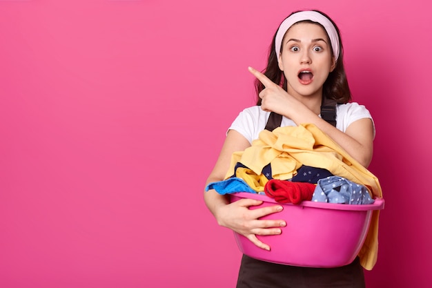 Shocked caucasian housewife with white headband