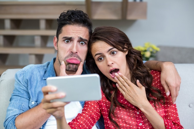 Shocked couple taking self portrait