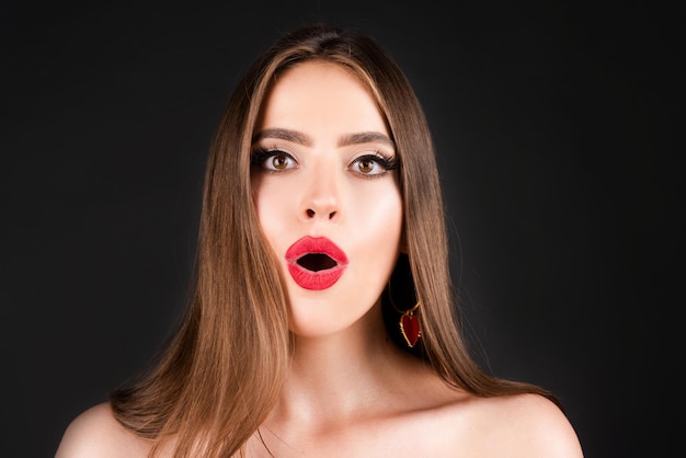 Shocked face of surprised young woman Funny female shocked face expression Unbelievable Portrait of excited woman spreading hands Expressing surprise open mouth Emotional face