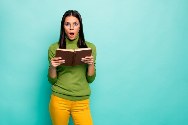 Shocked girl reading book