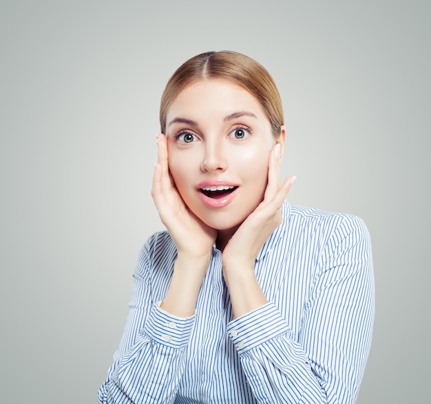 Shocked girl student on white background Emotions facial expression